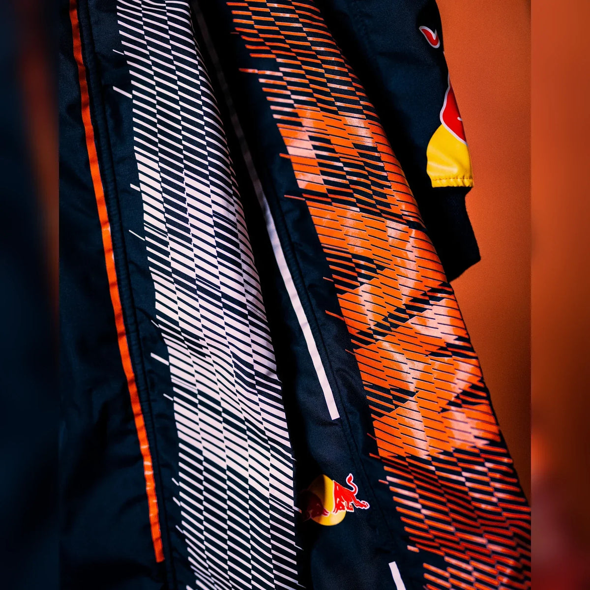 2026 Zandvoort race suit orange and white fabric detail by Active Racegear