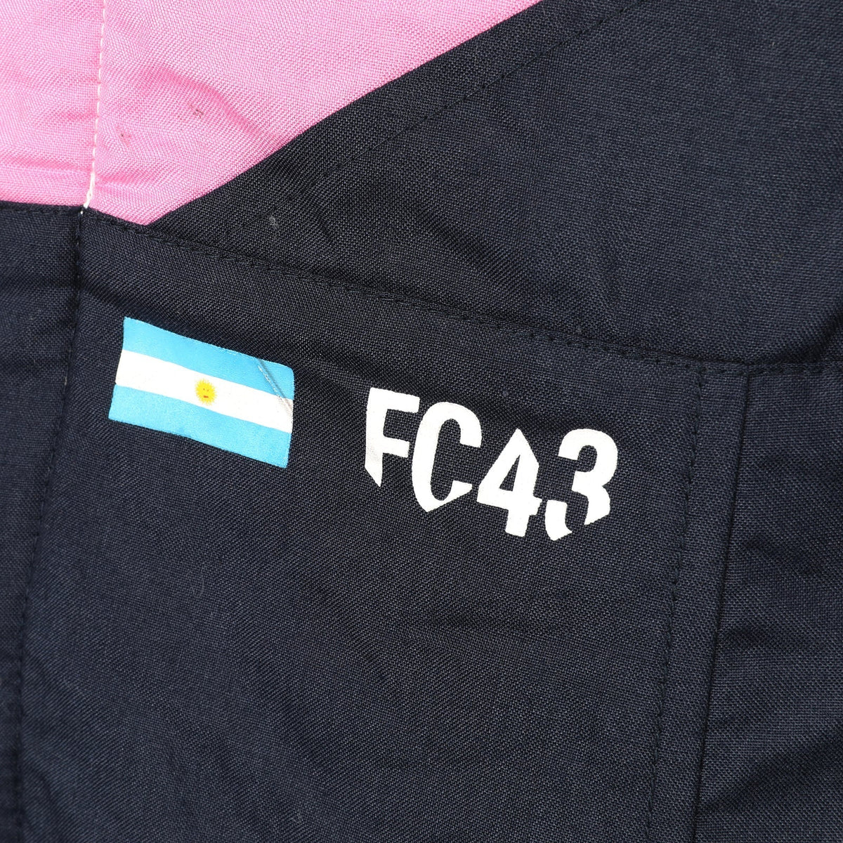 Franco Colapinto FC43 and Argentina flag detail on the 2026 Alpine F1 race suit – Active Racegear.